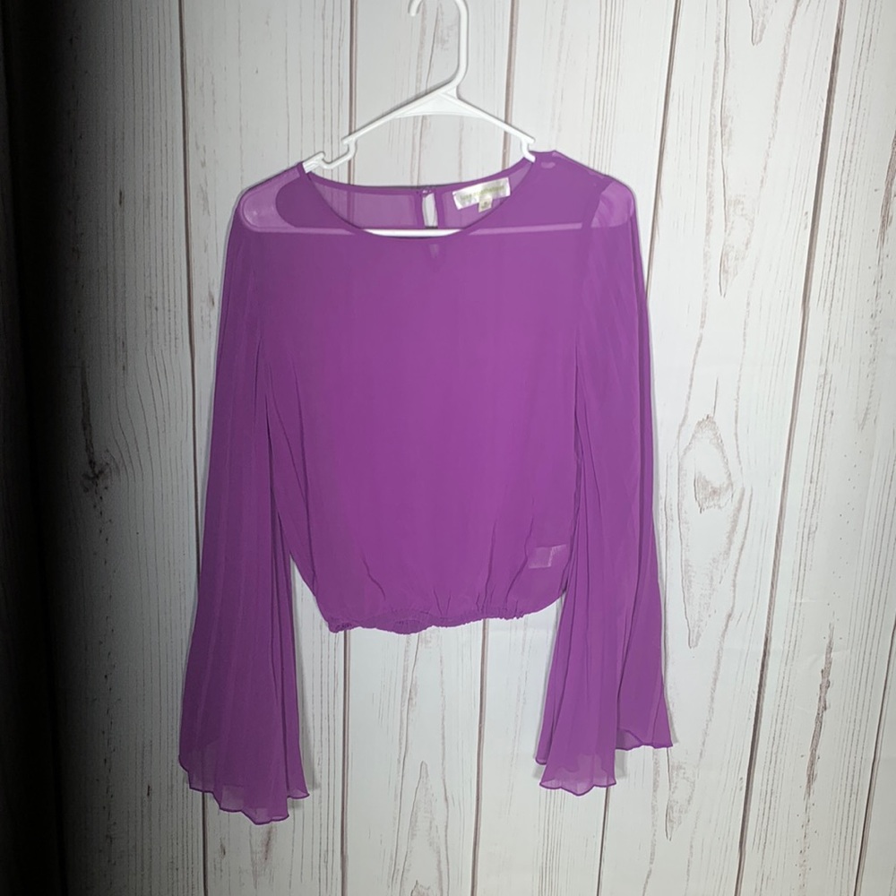 Sheer top with pleated sleeves. 70% silk / 30% polyester.
